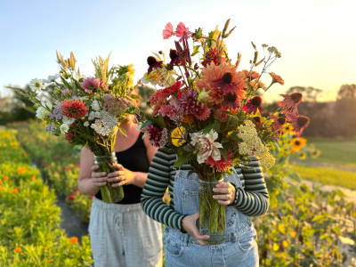 two women with their u-pick bouquets from Dahlia May Flower Farm