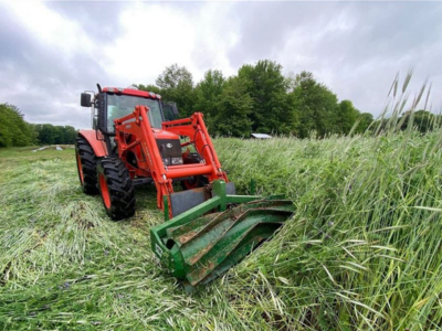 crimping a cover crop using a tractor